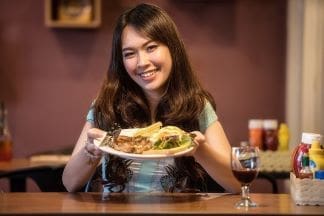 Young woman eating a healthy meal