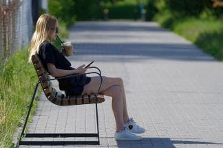 how to live a fulfilling life-woman taking a brake on a park bench