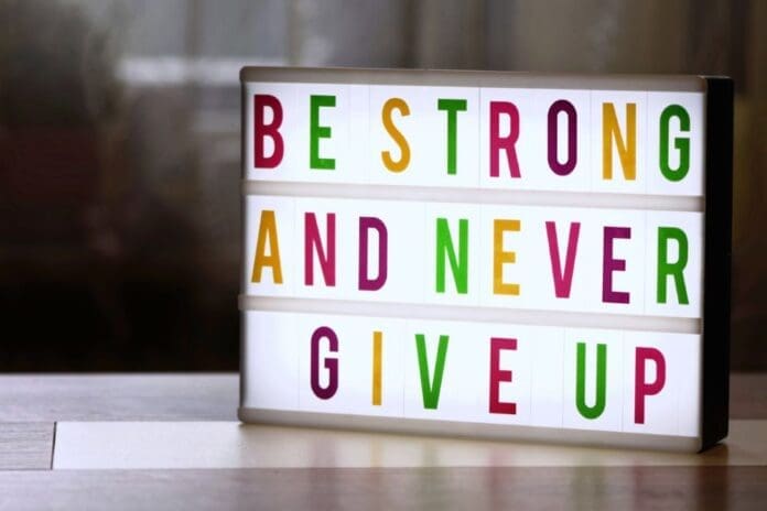 Be strong and never give up sign