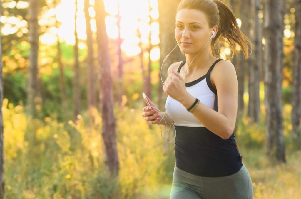 Woman running with earbuds